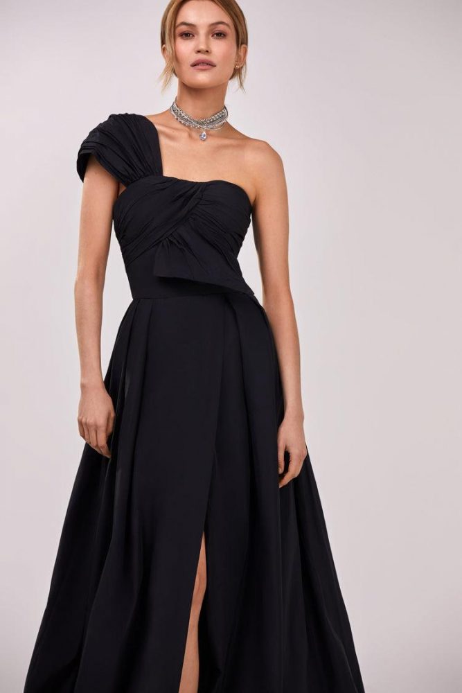 Black taffeta evening gown with a high slit and one-shoulder wrap top